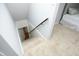 Carpeted staircase leads to the upper floor, adjacent to a bedroom with a tufted headboard at 106 E Club Blvd, Durham, NC 27704