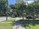 A picturesque street view with mature trees lining the sidewalk at 106 E Club Blvd, Durham, NC 27704