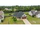 Aerial shot showcasing the property's layout, landscaped yard, and neighborhood surroundings at 106 Lockwood Dr, Cameron, NC 28326