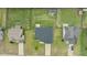 Birds-eye view of a well-kept house in a neighborhood setting featuring a grassy lawn and long driveway at 106 Lockwood Dr, Cameron, NC 28326