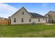 Well-maintained backyard with lush green grass and a small patio area, perfect for outdoor relaxation at 106 Lockwood Dr, Cameron, NC 28326