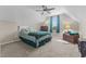 Comfortable, neutrally-toned bedroom with a ceiling fan, lamps, and comfy carpeted floor at 106 Lockwood Dr, Cameron, NC 28326