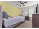 Comfortable bedroom featuring a ceiling fan, lots of natural light, and comfortable seating at 106 Lockwood Dr, Cameron, NC 28326