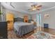 Comfortable bedroom featuring hardwood floors, ceiling fan, and neutral paint, creating a relaxing space at 106 Lockwood Dr, Cameron, NC 28326