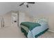 This comfortable bedroom has soothing colors and a beautiful bed and ceiling fan at 106 Lockwood Dr, Cameron, NC 28326