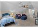 Comfortable bonus room offering a bed, sitting area, and ceiling fan at 106 Lockwood Dr, Cameron, NC 28326