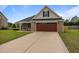 Beautiful brick home with well-maintained lawn and a two-car garage at 106 Lockwood Dr, Cameron, NC 28326