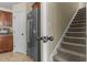 Modern kitchen featuring stainless steel appliances with neutral tile and stairway to a second level at 106 Lockwood Dr, Cameron, NC 28326