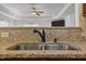 Kitchen with stainless steel sink, granite countertop, and modern faucet fixture at 106 Lockwood Dr, Cameron, NC 28326