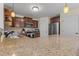 Bright kitchen features granite countertops, stainless steel appliances, and custom wood cabinets at 106 Lockwood Dr, Cameron, NC 28326