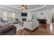 Well-lit living room featuring hardwood floors, a fireplace, and ample seating at 106 Lockwood Dr, Cameron, NC 28326