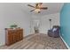 A welcoming room with hardwood floors, neutral walls, ceiling fan, and natural light from the glass door at 106 Lockwood Dr, Cameron, NC 28326
