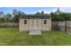 Outdoor storage shed featuring a ramp and neutral exterior to match the house at 106 Lockwood Dr, Cameron, NC 28326