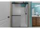 Modern shower with glass door and contemporary fixtures inside the bright and clean bathroom at 106 Lockwood Dr, Cameron, NC 28326