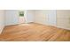 Large basement area with wood-look floors and multiple storage options at 1085 Bynum Rd, Pittsboro, NC 27312