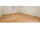 Basement area with laminate floors and clean white painted block walls at 1085 Bynum Rd, Pittsboro, NC 27312