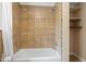 Bathroom with tiled shower, tub, and built-in shelves at 1085 Bynum Rd, Pittsboro, NC 27312