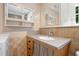 Bathroom vanity features granite countertop, stylish fixtures, ample storage, and natural light at 1085 Bynum Rd, Pittsboro, NC 27312