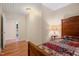 Comfortable bedroom with cozy bed and a lamp on a bedside table at 1085 Bynum Rd, Pittsboro, NC 27312