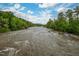 Scenic view of the river and surrounding lush green trees, offering a peaceful natural ambiance at 1085 Bynum Rd, Pittsboro, NC 27312