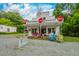 Front of music venue/grocery store featuring colorful chairs, ample parking, and a lively atmosphere at 1085 Bynum Rd, Pittsboro, NC 27312
