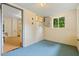 Utility room with blue painted floors and white cinder block walls at 1085 Bynum Rd, Pittsboro, NC 27312