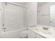 Bright bathroom with tub and shower combination and single sink with white cabinets at 109 Ruby Walk Dr, Morrisville, NC 27560