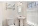 Comfortable half bathroom featuring a pedestal sink and stylish fixtures at 109 Ruby Walk Dr, Morrisville, NC 27560