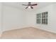 A light-filled bedroom with carpeted floors and a large window to let in natural light at 109 Ruby Walk Dr, Morrisville, NC 27560