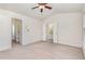 Spacious bedroom with neutral carpet, ceiling fan, and ensuite bathroom and walk-in closet at 109 Ruby Walk Dr, Morrisville, NC 27560