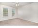 Neutral bedroom with carpet and two windows for natural light and ventilation at 109 Ruby Walk Dr, Morrisville, NC 27560