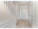 Welcoming foyer with light walls, paneled trim, durable floors, and a staircase at 109 Ruby Walk Dr, Morrisville, NC 27560