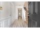 Bright foyer features paneled walls, durable floors, and a staircase with neutral carpeting at 109 Ruby Walk Dr, Morrisville, NC 27560