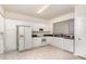 Well-equipped kitchen featuring white cabinets and modern appliances at 109 Ruby Walk Dr, Morrisville, NC 27560