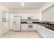 Well-lit kitchen featuring white appliances, ample cabinetry, and granite countertops at 109 Ruby Walk Dr, Morrisville, NC 27560