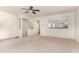 Open-concept living room featuring a ceiling fan and stairs leading to the second floor at 109 Ruby Walk Dr, Morrisville, NC 27560