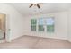 Main bedroom with lots of natural light and a doorway to the ensuite bathroom at 109 Ruby Walk Dr, Morrisville, NC 27560