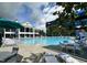 Large swimming pool surrounded by lounge chairs and umbrellas at a community center at 109 Ruby Walk Dr, Morrisville, NC 27560