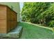 Large backyard showcasing ample greenery and a small storage shed on the left at 116 Hamilton Hedge Pl, Cary, NC 27519