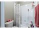 Shower and toilet area featuring white tile and shower curtain at 116 Hamilton Hedge Pl, Cary, NC 27519