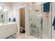 Bathroom with shower, glass doors, seat, vanity, mirror, lighting, and toilet at 116 Hamilton Hedge Pl, Cary, NC 27519