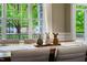 Stylish dining room featuring a long table, comfortable chairs, a large window, and decorative centerpieces at 116 Hamilton Hedge Pl, Cary, NC 27519