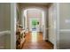 Inviting foyer with hardwood floors, arched doorway, and a view of the front door and yard at 116 Hamilton Hedge Pl, Cary, NC 27519