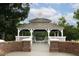 Charming gazebo with detailed trim and scenic views, perfect for relaxation and community gatherings at 116 Hamilton Hedge Pl, Cary, NC 27519