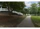 Scenic walking path alongside a lake, featuring a charming gazebo and staircase at 116 Hamilton Hedge Pl, Cary, NC 27519