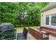 Back patio featuring a modern outdoor seating area and glass-top table, perfect for entertaining at 116 Hamilton Hedge Pl, Cary, NC 27519