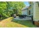 Outdoor patio with a stone ground, outdoor furniture, and a well-manicured lawn at 116 Hamilton Hedge Pl, Cary, NC 27519