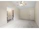 Spacious bedroom with a vaulted ceiling, ceiling fan, and adjoining bathroom with a sink at 118 Setter Pt, Clayton, NC 27520