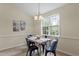 Bright dining area with a window, table, chairs, and neutral paint colors at 118 Setter Pt, Clayton, NC 27520