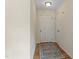 Welcoming entryway with a white door, hardwood floors, and neutral-colored walls at 118 Setter Pt, Clayton, NC 27520